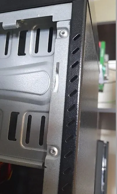 screws fixed on a chassis in gaming PC